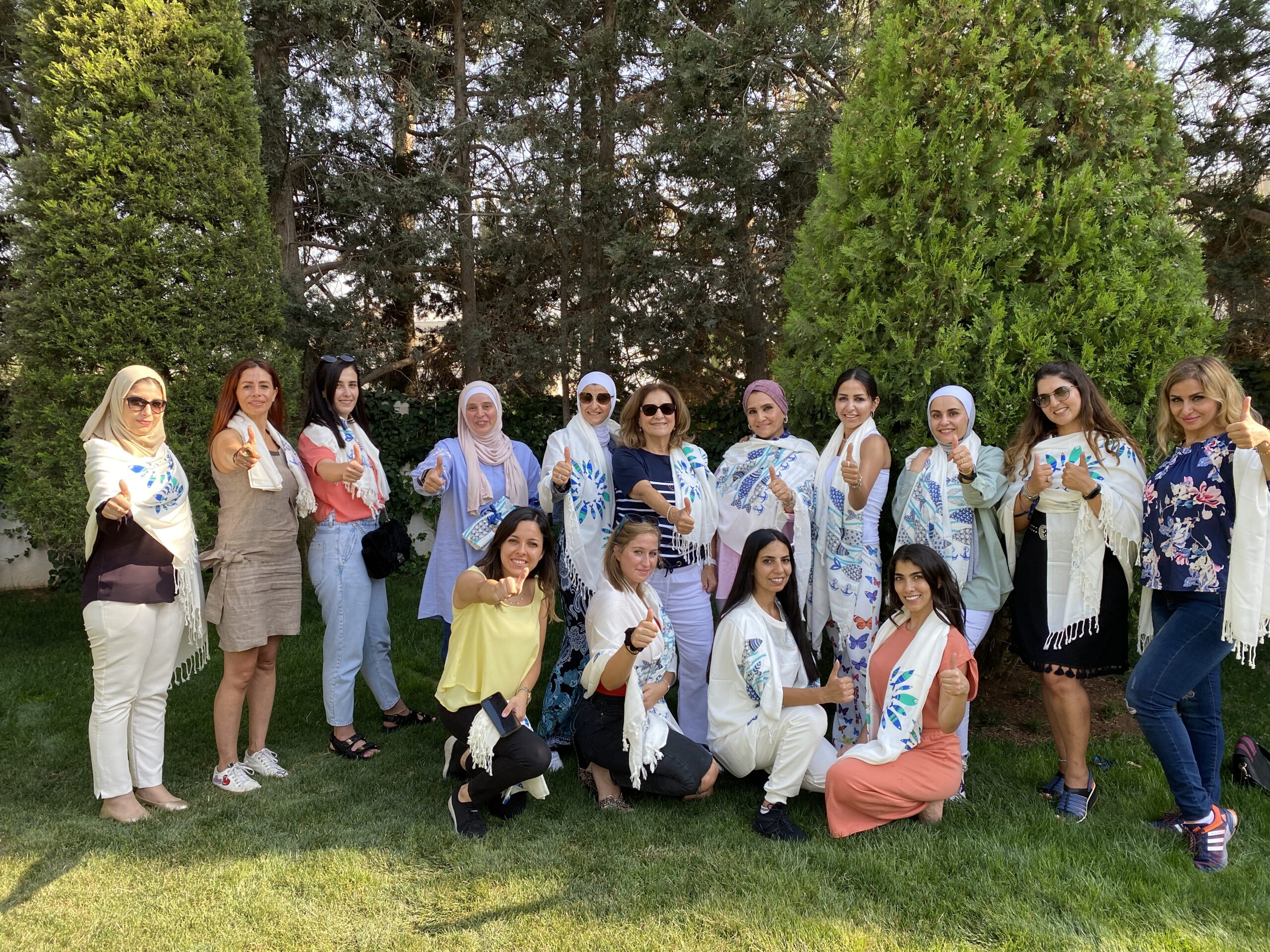 One With Nature team gathering in a garden