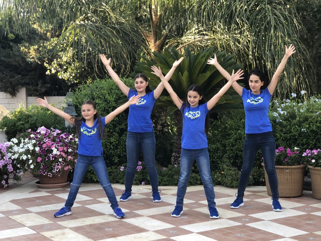 Children in RAXA Fitness Kids™ T-shirts dancing outdoors